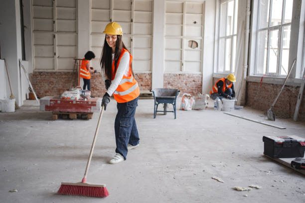 Our cleaner sweeping a construction site during builders clean